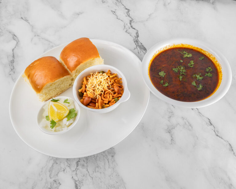 Kolhapuri misal pav, spicy sprouted curry topped with farsan served with pav bread